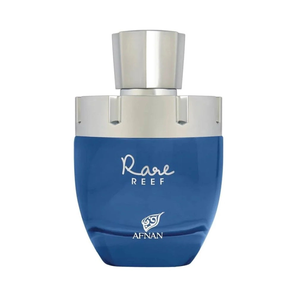 A deep ocean-blue glass perfume bottle with a rounded base and a structured silver metallic cap, featuring the name "Rare Reef" in elegant silver script above the Afnan brand logo, set against a clean white background. Available at civet 100% original and authentic.
